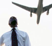 Man looking at an airplane