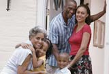 Family at their home's front door