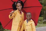 Little girls under a red umbrella