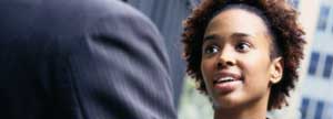 Businesswoman having a chat with man