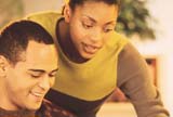 Couple reviewing information in computer