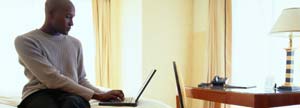 Man working at his hotel room