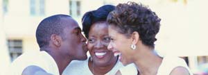 Man giving a kiss to his mom