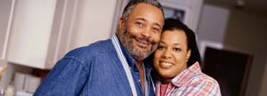 Grown couple hugging in kitchen