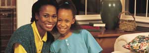 Mom and daughter smiling