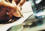 Woman signing a document