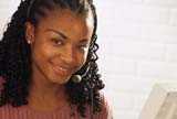 Young woman turning her head towards camera