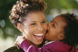 Woman carrying little kid