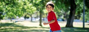 Kid running in a park