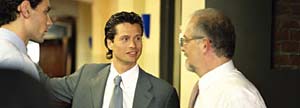 Three business people talking on the office