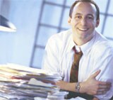 Man with a stack of paper.