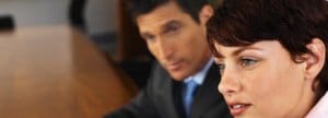 Man and woman at conference table