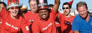 Scotiabank employees riding a bike for charity