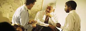 Three people at a business meeting