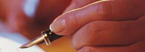Close up of a hand holding a fountain pen