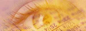 Close up of an eye with financial figures in background