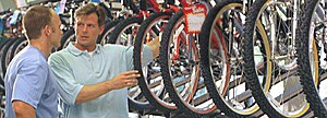 Two men in a bike shop.