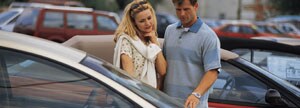 Couple looking at cars