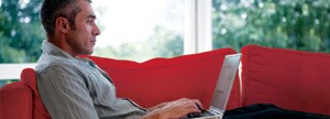 guy on couch with laptop