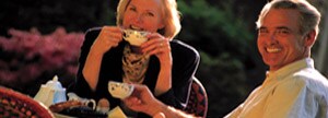 Couple having tea outside