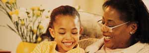 Woman reading to young girl