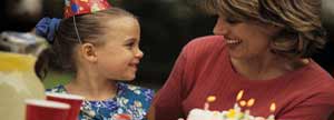 Mother and Daughter with birthday cake