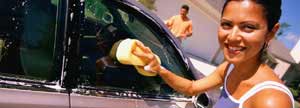 Woman washing a car