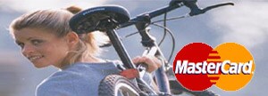 Woman carrying bike with MasterCard logo in foreground