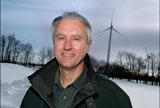Man in front of wind turbine
