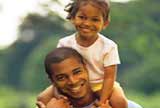 Daughter on father's shoulders