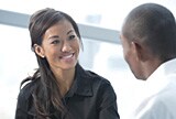 A woman and man talking.