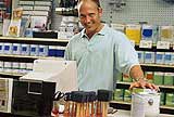 A man selling in a hardware store.