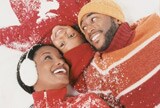 Family lying in the snow