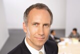 Businessman with meeting in the background