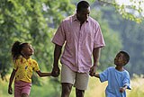 father walking with children