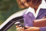woman with cell phone on the move