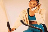 woman on phone while exercising