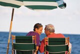 couple under beach umbrella