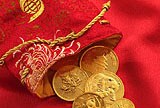Gold coins spilling out of a bag