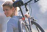 Woman carrying bike