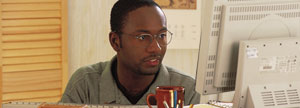 Young Man working in front of the Computer