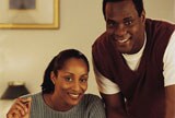 A couple looking forward smiling