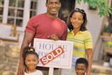 Family infront of their new house