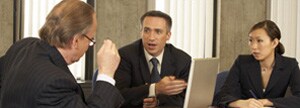 3 businesspeople at a meeting