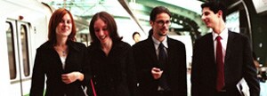 4 businesspeople on street
