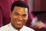 Portrait of a man looking at camera smiling
