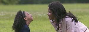 Girl playing with her mom in a park