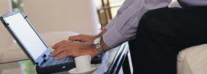 Man using his laptop in the living room