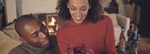 Woman receiving a birthday present