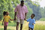 Two kids with their father